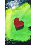 Green Christmas Thief bath bomb with a soap heart inside